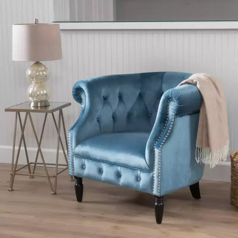 Fauteuil club contemporain capitonné avec clous de tapissier