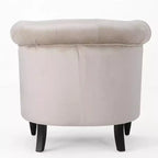 Fauteuil club contemporain capitonné avec clous de tapissier