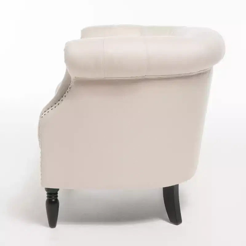 Fauteuil club contemporain capitonné avec clous de tapissier