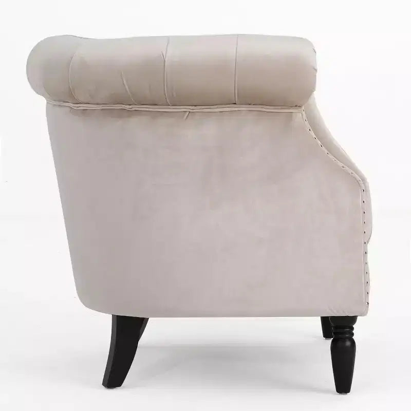 Fauteuil club contemporain capitonné avec clous de tapissier