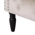Fauteuil club contemporain capitonné avec clous de tapissier