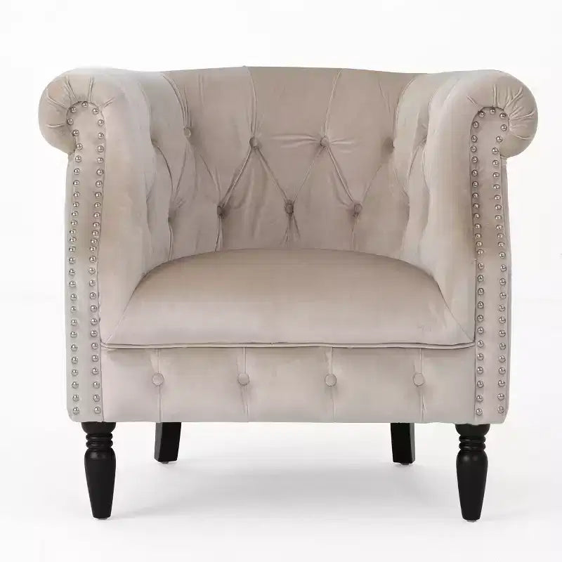 Fauteuil club contemporain capitonné avec clous de tapissier