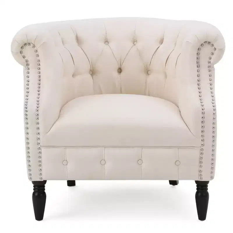 Fauteuil club contemporain capitonné avec clous de tapissier