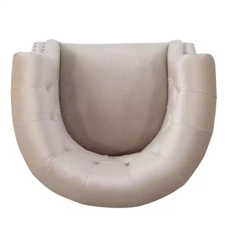 Fauteuil club contemporain capitonné avec clous de tapissier